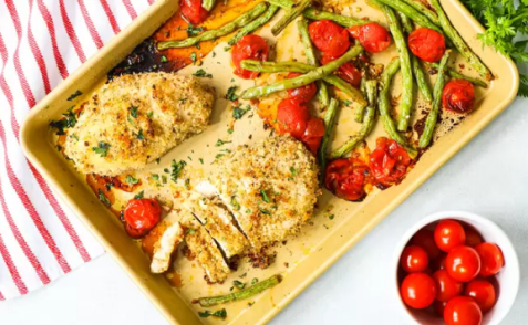 Garlic Parmesan Chicken in pan with green beans and tomatoes
